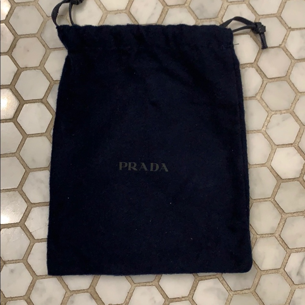 Navy blue Prada dust bag from a belt